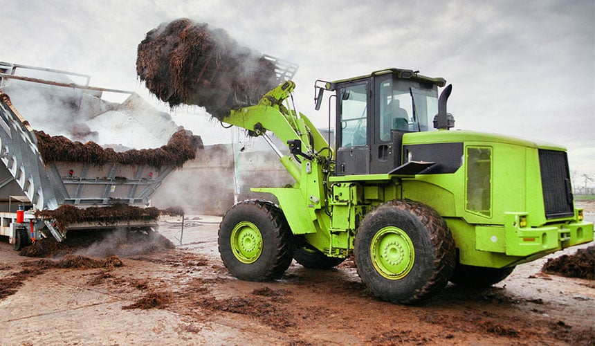 Composting organic waste with a loader